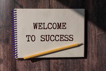 Obraz premium Sticker with text welcome to success in the middle of wooden cubes with letters