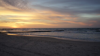 Fototapeta premium Sunset on the beach by the sea