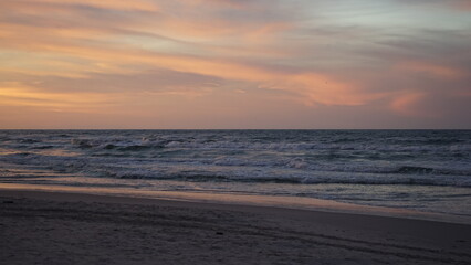 Fototapeta premium Sunset on the beach by the sea