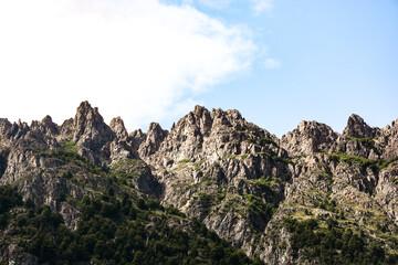 Beautiful close up of rocky mountains part of a challenging trekking trail that connects Natacion Lake and Cajon del Azul landmarks in El Bolson, Rio Negro, Argentina.