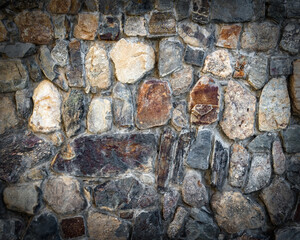 the texture of the stone wall is darkened at the edges. copy space.