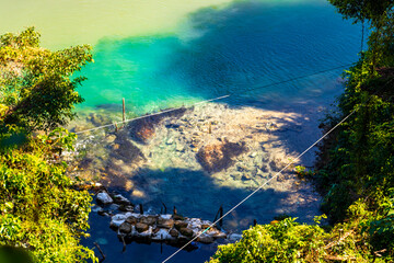 Tham Chang cave with water source river in Vang Vieng Laos.