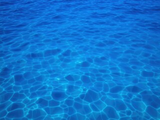 Obraz premium Smooth and mesmerizing deep blue sea texture with gentle waves and ripples, texture, water, deep blue