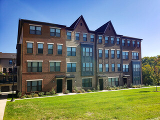 modern four-story brick townhouse