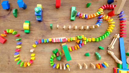 city with dominoes, gravity, and pattern recognition, collaborative domino-building activities, children's imaginations as craft miniature cities using dominoes, fostering creativity