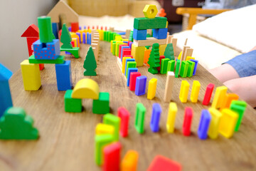 child building city with dominoes, understand the scientific principles behind the domino effect, Playful Learning Through Dominoes