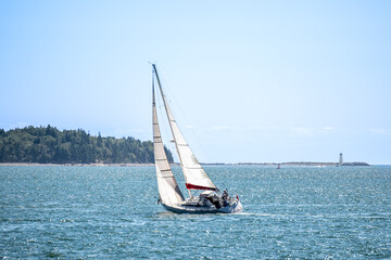 Obraz premium Sailing yacht racing on blue sea