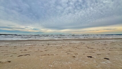 Sandy beach on a cloudy day