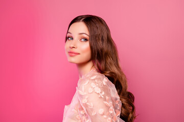 Gorgeous cute girl posing showing hairdress after visiting hair stylist and visagist on pink color background