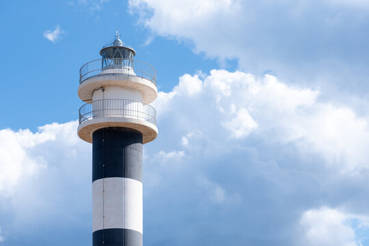 close-up of a lighthouse with a background of clouds - Powered by Adobe
