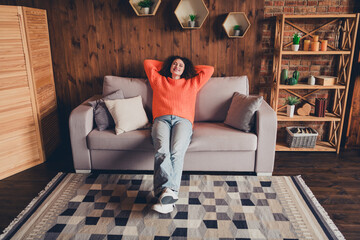 Obraz premium Full size photo of pretty young woman sit sleep couch loft interior apartment indoors