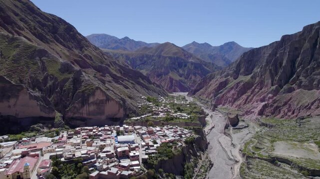 iruya town between mountains on a sunny day with blue sky in the background in Salta, Argentina