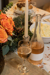 Holiday Dinner with wine glasses. Cozy Thanksgiving candle dining