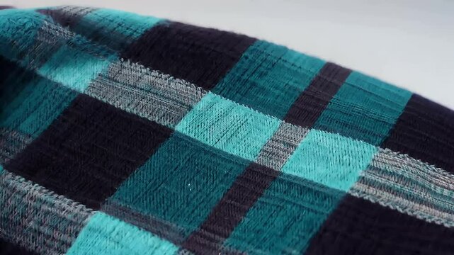 scarf captured using dolly slider Laowa probe lens fine textile details high definition foulard clothing threaded texture fabric close warm knitwear clothes sliding soft textured stitch thread woven