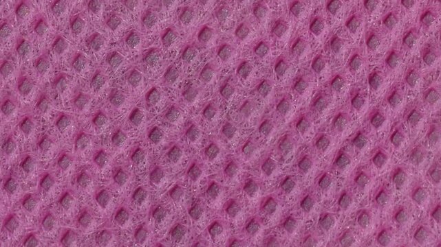 surface texture background of the purple non-woven fabric is rough and porous. polypropylene fabric