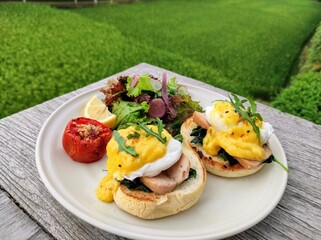 Eggs Benedict and salad