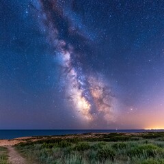 Milky Way galaxy over a calm ocean at night.