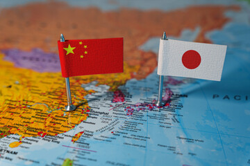 Naklejka premium China and Japan flags on world map