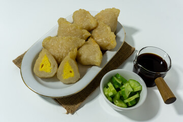 Pempek or mpek-mpek is a delicacy from Palembang, South Sumatra. It is made of fish and sago flours and served together with a dark, rich sauce called cuko.