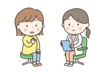 女性医師に症状を不安な様子で話す女性