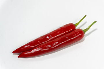 red hot chili peppers on white background. Chili spur pepper ( Cayenne pepper, long fed pepper,...
