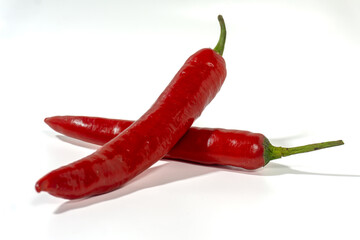 red hot chili peppers on white background. Chili spur pepper ( Cayenne pepper, long fed pepper, spur pepper) on white background