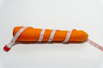 Carrot wrapped in measuring tape