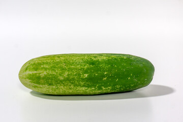 Green cucumber isolated on white background. Green cucumbers texture template arranged and harvested
