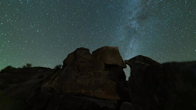 Timelapse tracking of Milky Way galaxy over Native American petroglyphs in Eastern Sierra, California