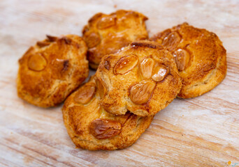 Cookies on a wooden table, delicious dessert with almond. Homemade cookies with almond on wooden table