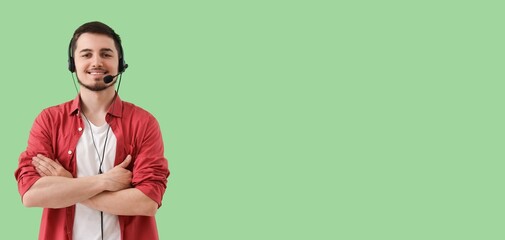 Male technical support agent on green background with space for text