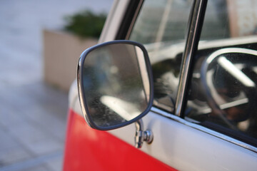 An Impressive CloseUp View of a Vintage Vehicles Side Mirror and Its Intricate Details