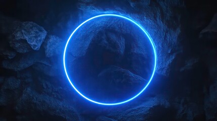 Fototapeta premium A glowing blue neon circle against a dark rocky background.