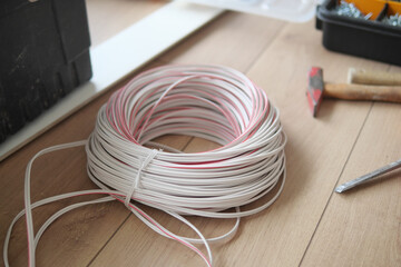 The thick white wire on floor 