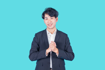 Smiling handsome young man southeast asian man on blue background