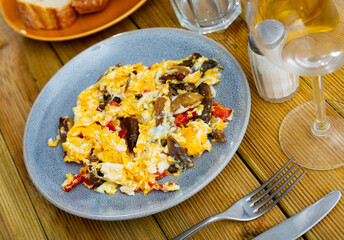 Delicious omelette with mushrooms and bell peppers for breakfast