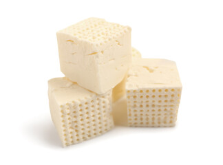 Delicious cut feta cheese on white background