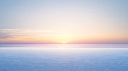 A serene sunset over a calm, cloud-filled sky with a soft, pastel color palette.