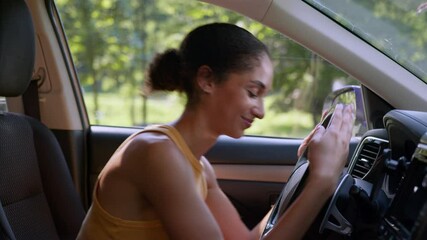 Happy African American woman buyer female sit luxury new car auto hugging wheel steering owner automobile buying enjoy businesswoman vehicle embrace hug rent service test drive cuddling girl business