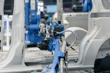 Fototapeta premium robot arm working in car factory