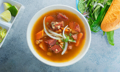 Bowl of tasty Bo Kho. Bowl of delicious Vietnamese stewed beef noodle - Bo Kho. Read with stewed beef. Vietnam food