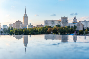 Obraz premium View of Berezhkovskaya Embankment in Moscow with reflection on a mirror stone surface
