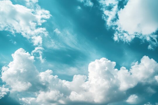White clouds on a blue sky with a turquoise hue. - Powered by Adobe