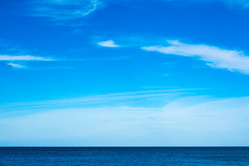 Nature of the beach and sea Summer with sunshine, sandy beaches, clear blue waters sparkling against the blue sky. On an island with good ecology and environment Background for summer vacation