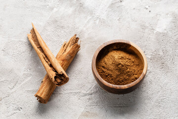 Cinnamon Sticks and Powder on White Background