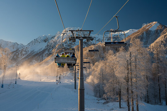 Skiers on chairlift at Rosa Khutor ski resort