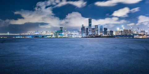Obraz premium Asphalt road square and modern city buildings scenery at night in Shenzhen. car advertising background.