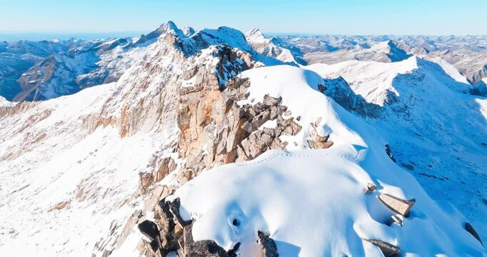 Aerial view of  snow mountain summit in the winter sunny day at Sichuan China Dagu glacier