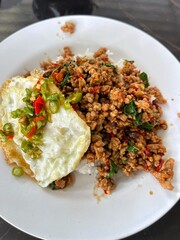 Rice topped with stir-fried pork and basil, Rice topped with stir fried minced pork and basil with Fried egg