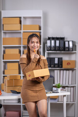 Startup small business entrepreneur SME, asian woman receive order on phone. Success young Asian small business owner home office, online sell marketing delivery, SME e-commerce telemarketing concept